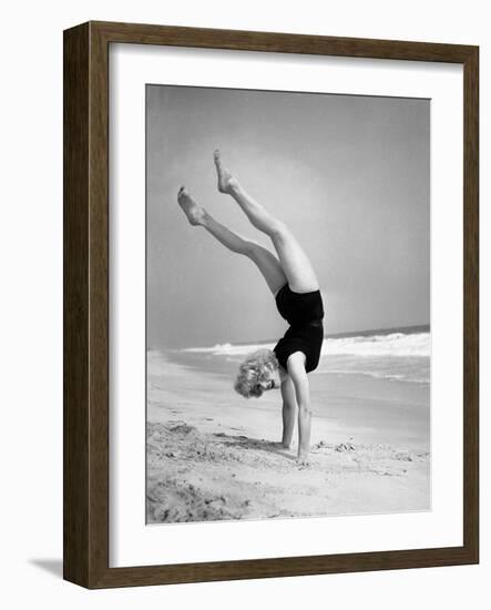 Woman Does Handstand on the Beach (B&W)-Hulton Archive-Framed Photographic Print