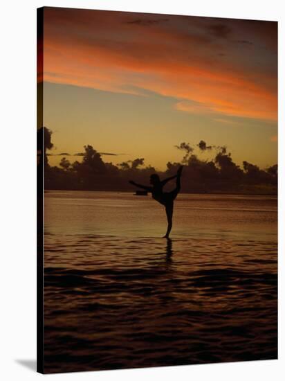 Woman Doing Yoga in Water at Sunset, Tahiti-Barry Winiker-Stretched Canvas