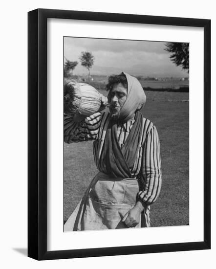 Woman Drinking a Bottles of Wine from a Story Concerning Italy-null-Framed Premium Photographic Print