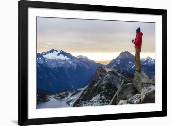 Woman Drinks Her Coffee On Top Of A Mountain In The Morning Looking Out Into The Cascade Mts In WA-Hannah Dewey-Framed Photographic Print