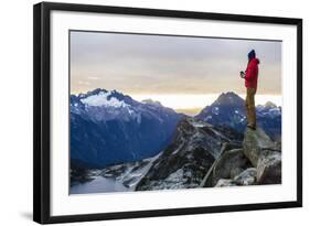 Woman Drinks Her Coffee On Top Of A Mountain In The Morning Looking Out Into The Cascade Mts In WA-Hannah Dewey-Framed Photographic Print