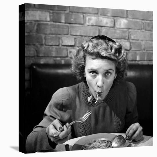 Woman Eating Spaghetti in Restaurant. No.5 of Sequence of 6-Alfred Eisenstaedt-Stretched Canvas