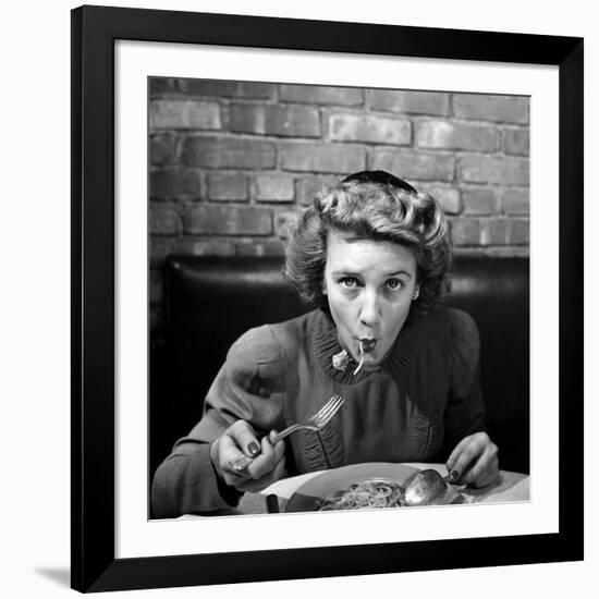 Woman Eating Spaghetti in Restaurant. No.5 of Sequence of 6-Alfred Eisenstaedt-Framed Photographic Print