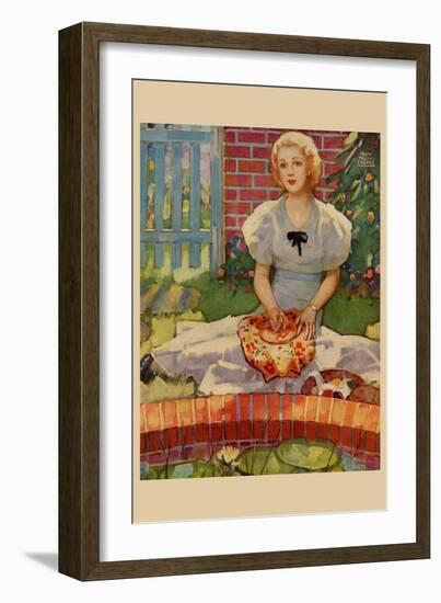 Woman Embroiders by the Side of a Home Pond-Home Arts-Framed Art Print