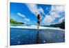 Woman enjoying the sun on one of Maui's black sand beaches, Hawaii-Laura Grier-Framed Photographic Print