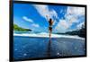 Woman enjoying the sun on one of Maui's black sand beaches, Hawaii-Laura Grier-Framed Photographic Print