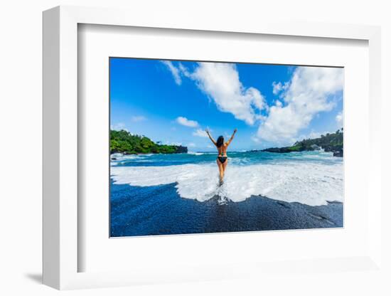 Woman enjoying the sun on one of Maui's black sand beaches, Maui, Hawaii-Laura Grier-Framed Photographic Print