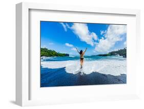 Woman enjoying the sun on one of Maui's black sand beaches, Maui, Hawaii-Laura Grier-Framed Photographic Print