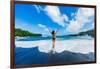 Woman enjoying the sun on one of Maui's black sand beaches, Maui, Hawaii-Laura Grier-Framed Photographic Print