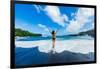 Woman enjoying the sun on one of Maui's black sand beaches, Maui, Hawaii-Laura Grier-Framed Photographic Print