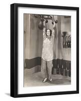 Woman Exercising in Silk Pajamas-null-Framed Photo