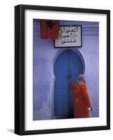 Woman Exits thru Moorish-Style Blue Door, Morocco-Merrill Images-Framed Photographic Print
