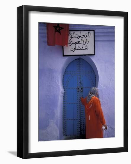 Woman Exits thru Moorish-Style Blue Door, Morocco-Merrill Images-Framed Photographic Print