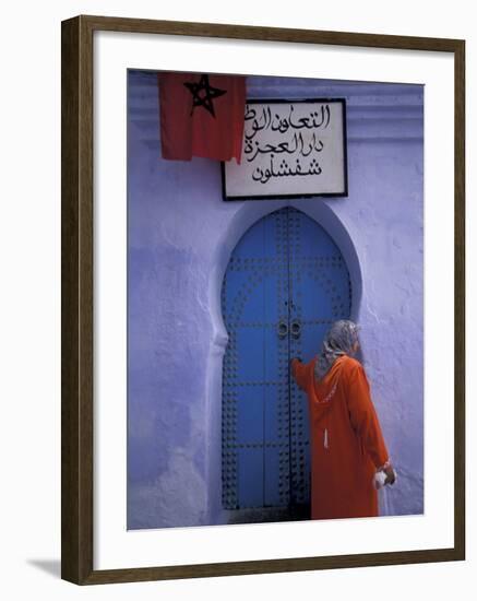 Woman Exits thru Moorish-Style Blue Door, Morocco-Merrill Images-Framed Photographic Print