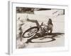 Woman Falling Off Her Bicycle on Side of Road-null-Framed Photo