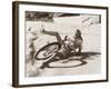 Woman Falling Off Her Bicycle on Side of Road-null-Framed Photo