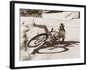 Woman Falling Off Her Bicycle on Side of Road-null-Framed Photo