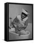 Woman Giving a Baby a Bath at a Nursery-null-Framed Stretched Canvas