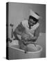 Woman Giving a Baby a Bath at a Nursery-null-Stretched Canvas