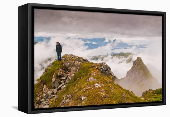 Woman high atop cloudy Harbor Mountain, Sitka, Alaska-Mark A Johnson-Framed Stretched Canvas