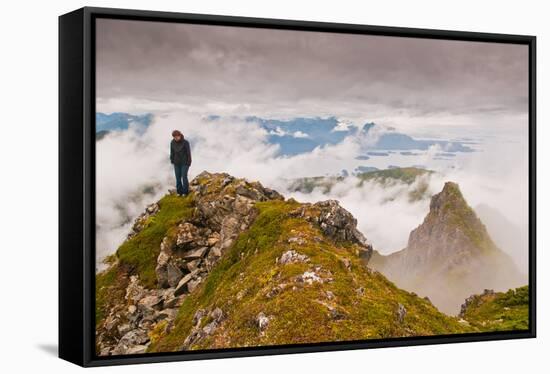 Woman high atop cloudy Harbor Mountain, Sitka, Alaska-Mark A Johnson-Framed Stretched Canvas