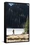 Woman Hiker Walks Alongside A Frozen Lake In The Olympic Mountain High Country During Winter In WA-Hannah Dewey-Framed Stretched Canvas