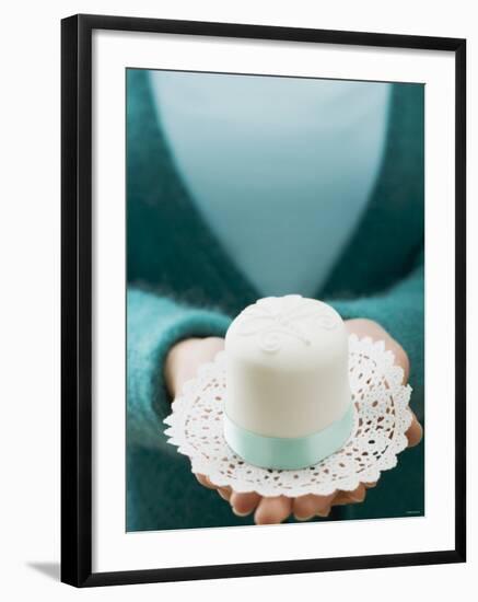 Woman Holding a Small White Cake on a Doily-null-Framed Photographic Print