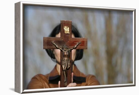 Woman holding forth a crucifix, Isere, France-Godong-Framed Photographic Print