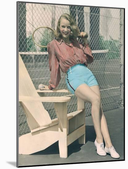 Woman Holding Tennis Racket-null-Mounted Photo