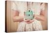 Woman Holding Vintage Mint Green Camera. Instagram Effect.-soupstock-Stretched Canvas