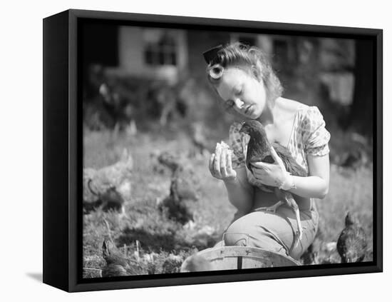 Woman Holds Chicken for Feeding-Philip Gendreau-Framed Stretched Canvas