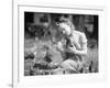 Woman Holds Chicken for Feeding-Philip Gendreau-Framed Photographic Print