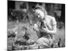 Woman Holds Chicken for Feeding-Philip Gendreau-Mounted Photographic Print