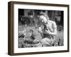 Woman Holds Chicken for Feeding-Philip Gendreau-Framed Photographic Print