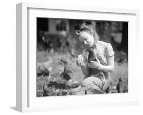 Woman Holds Chicken for Feeding-Philip Gendreau-Framed Photographic Print