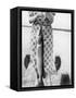 Woman Holds on Large Northern Pike on a Lake Pier, Ca. 1950-null-Framed Stretched Canvas