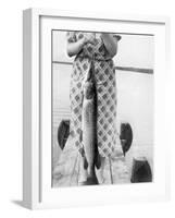 Woman Holds on Large Northern Pike on a Lake Pier, Ca. 1950-null-Framed Photographic Print