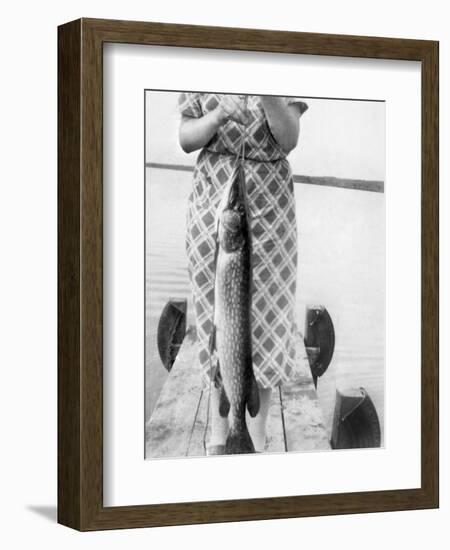 Woman Holds on Large Northern Pike on a Lake Pier, Ca. 1950-null-Framed Photographic Print