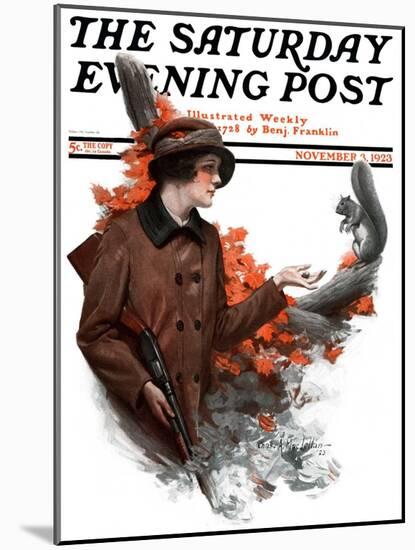 "Woman Hunter Feeding Squirrel," Saturday Evening Post Cover, November 3, 1923-Charles A. MacLellan-Mounted Giclee Print