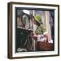 Woman in a Green Floppy Hat and Green Dress Browses in a Shop Selling Various Mirrors and Ornaments-null-Framed Art Print