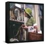 Woman in a Green Floppy Hat and Green Dress Browses in a Shop Selling Various Mirrors and Ornaments-null-Framed Stretched Canvas