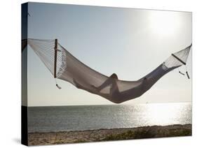 Woman in a Hammock on the Beach, Florida, United States of America, North America-Angelo Cavalli-Stretched Canvas