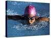 Woman in Action During a Butterfly Swimming Race-null-Stretched Canvas