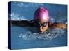 Woman in Action During a Butterfly Swimming Race-null-Stretched Canvas