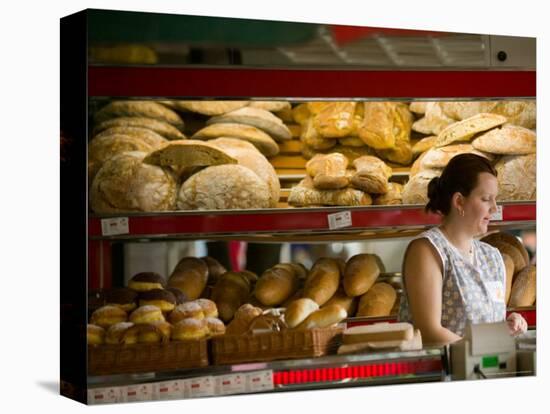 Woman in Bakery, Trogir, Croatia-Russell Young-Stretched Canvas