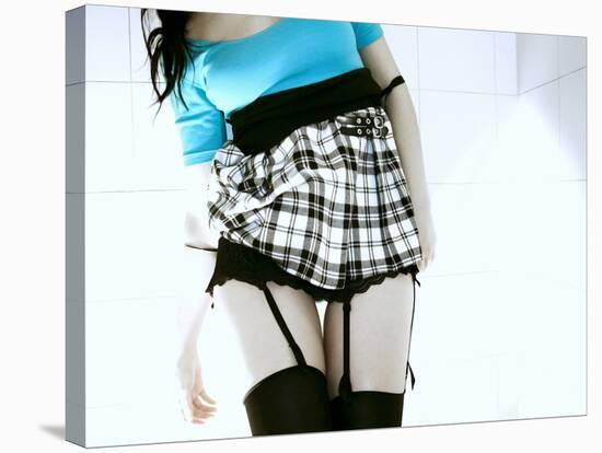 Woman in Garter Belts and Plaid Skirt-Paula Iannuzzi-Stretched Canvas