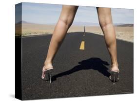 Woman in High Heels on Empty Road, Death Valley National Park, California-Angelo Cavalli-Stretched Canvas