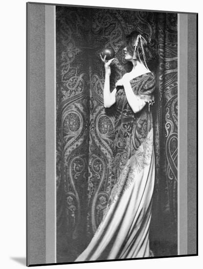 Woman in Long Gown Holding a Pomegranate-Zaida Ben-Yusuf-Mounted Photographic Print