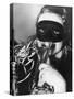 Woman in Mask Celebrating at a New Years Party-null-Stretched Canvas