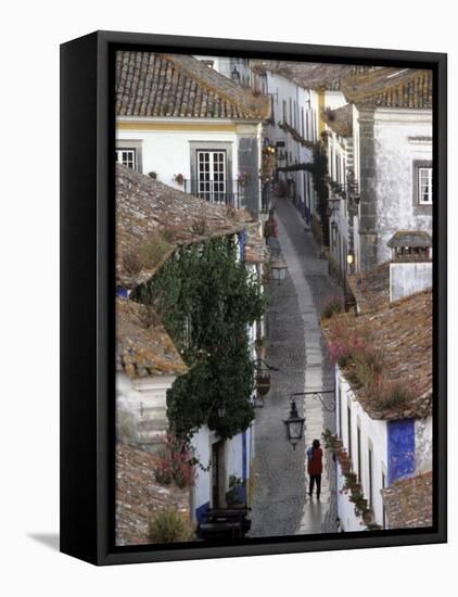 Woman in Narrow Alley with Whitewashed Houses, Obidos, Portugal-Merrill Images-Framed Stretched Canvas
